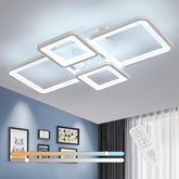 Modern ceiling light fixture with remote control in a room setting.